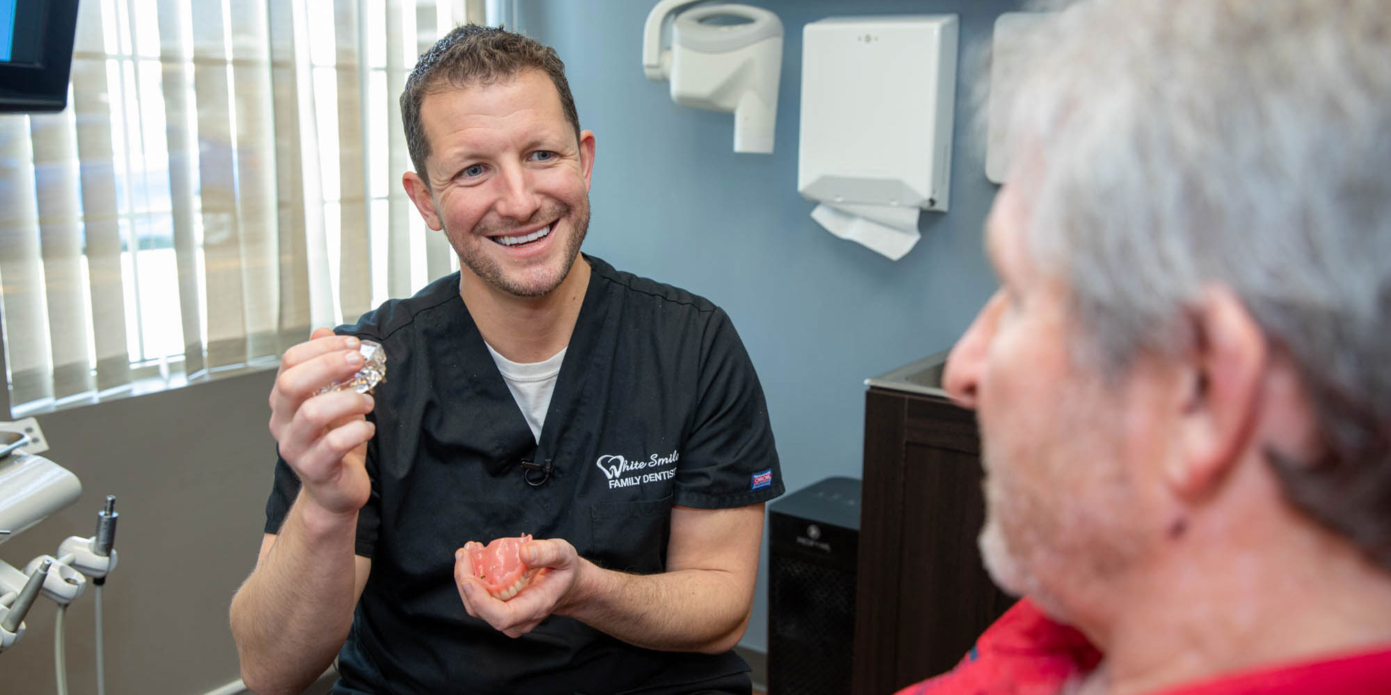 Dr. white with dental patient